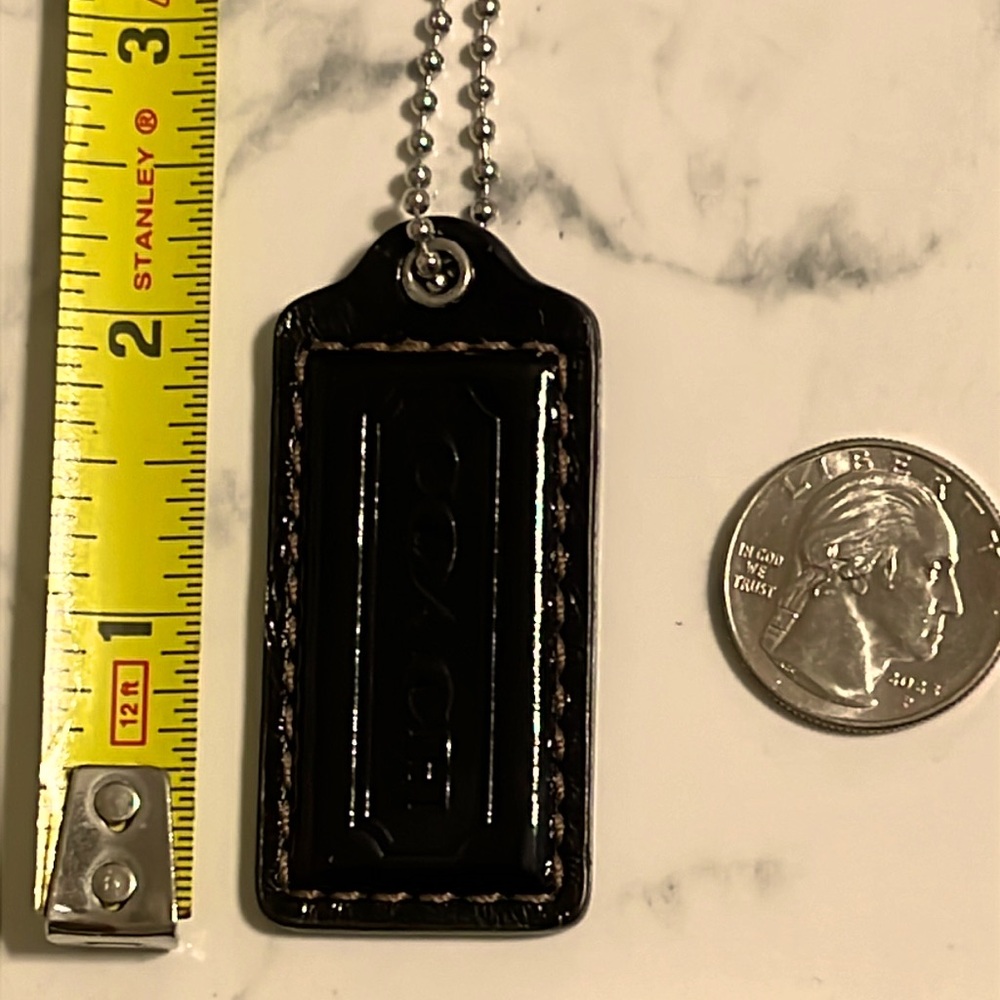 Coach  Patent leather hang tag with silver tone chain and hardware